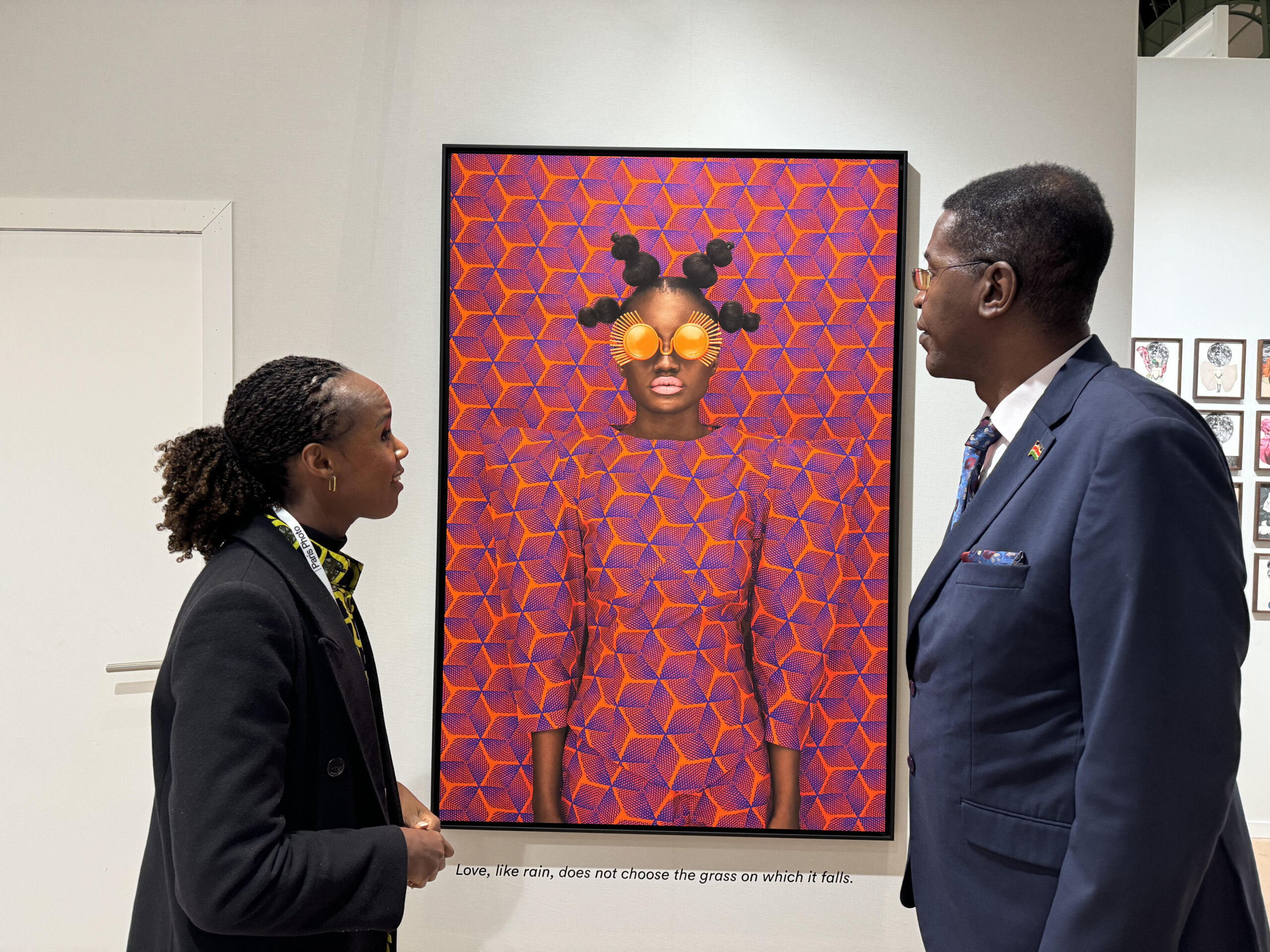 Amb. Peter Ngure admires one of Ms. Thandiwe's artwork at a recent show in Paris